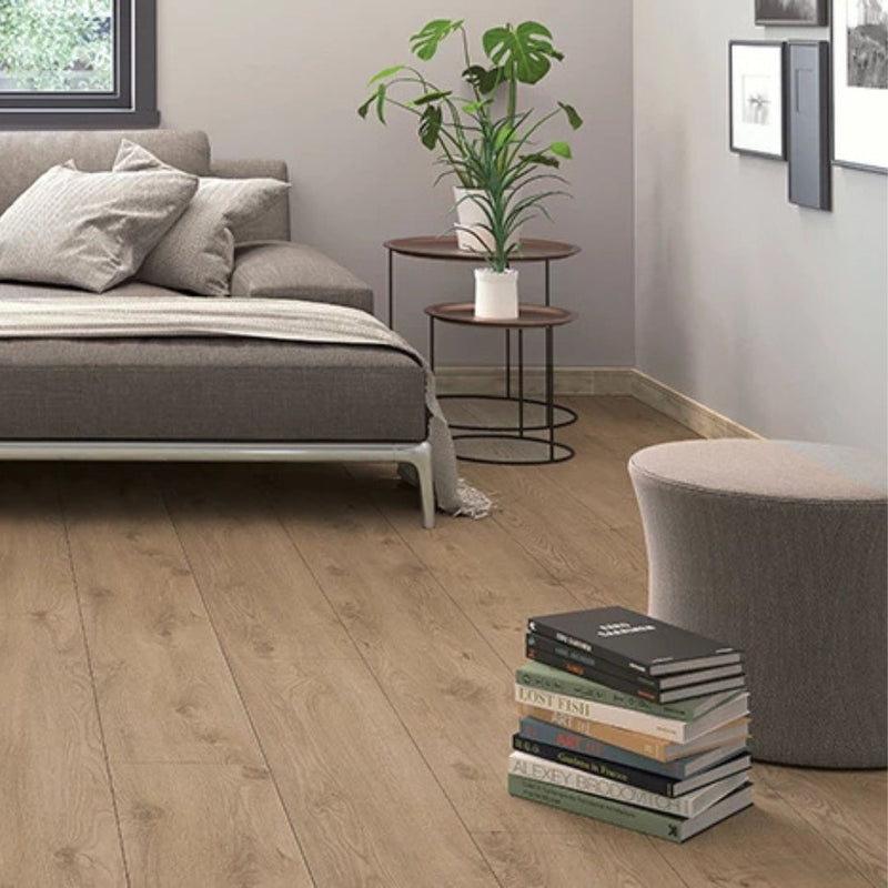 Milano light oak laminate flooring in a modern living room with grey sofa and indoor